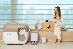 cat & owner resting next to the litter box